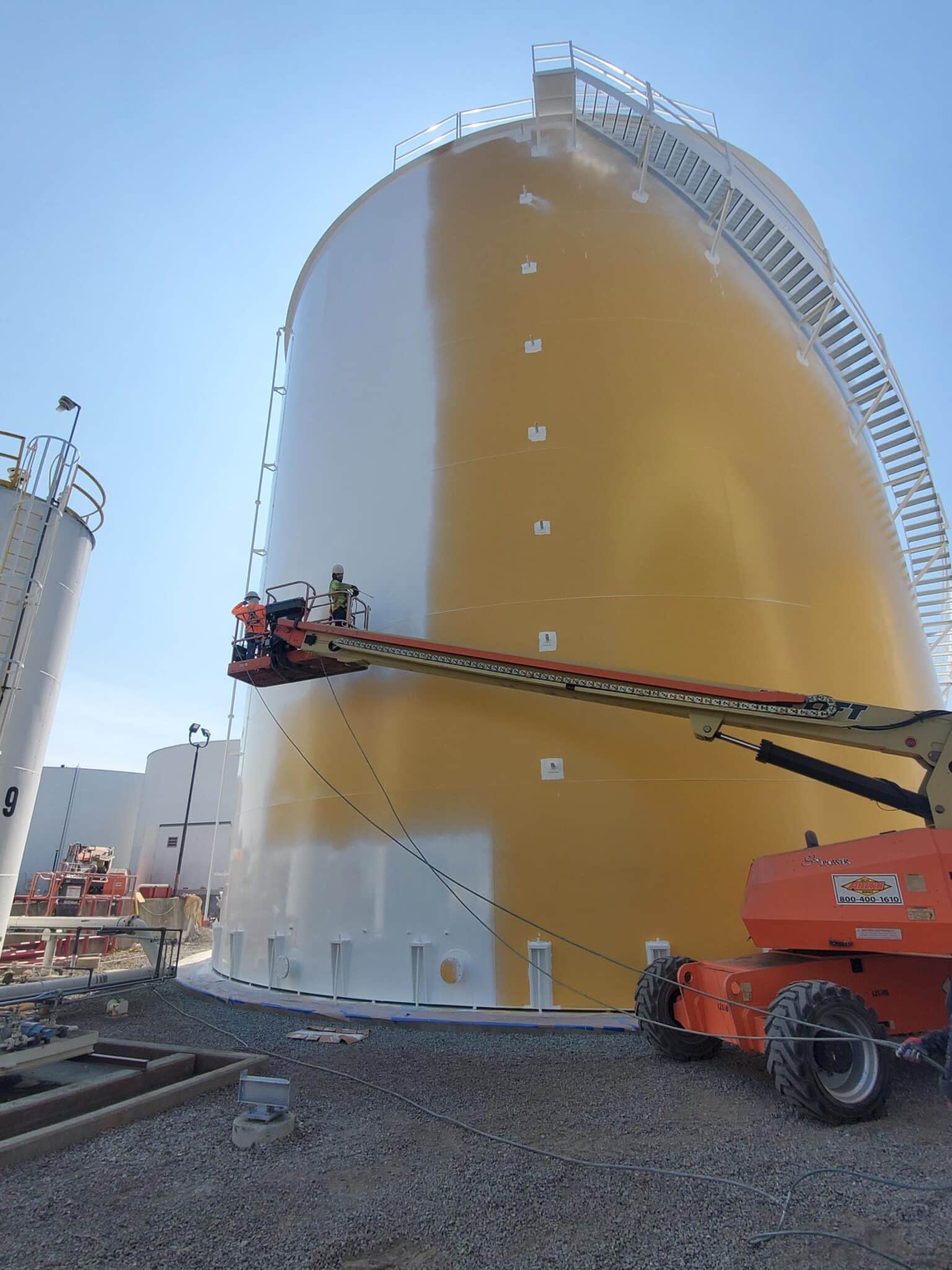 NACE-certified industrial coating application on aboveground steel storage tank