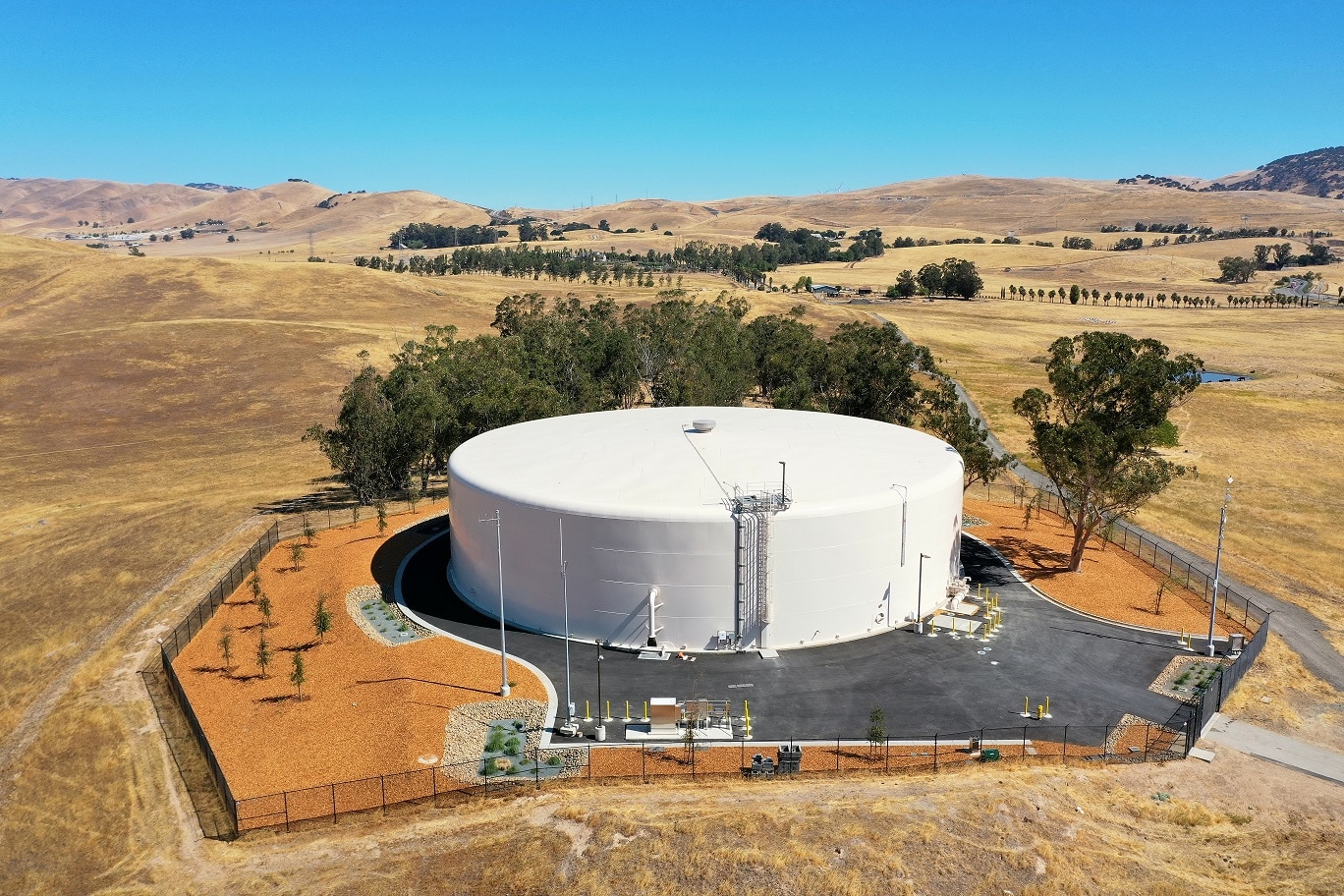 Large circular public water reservoir in landscape